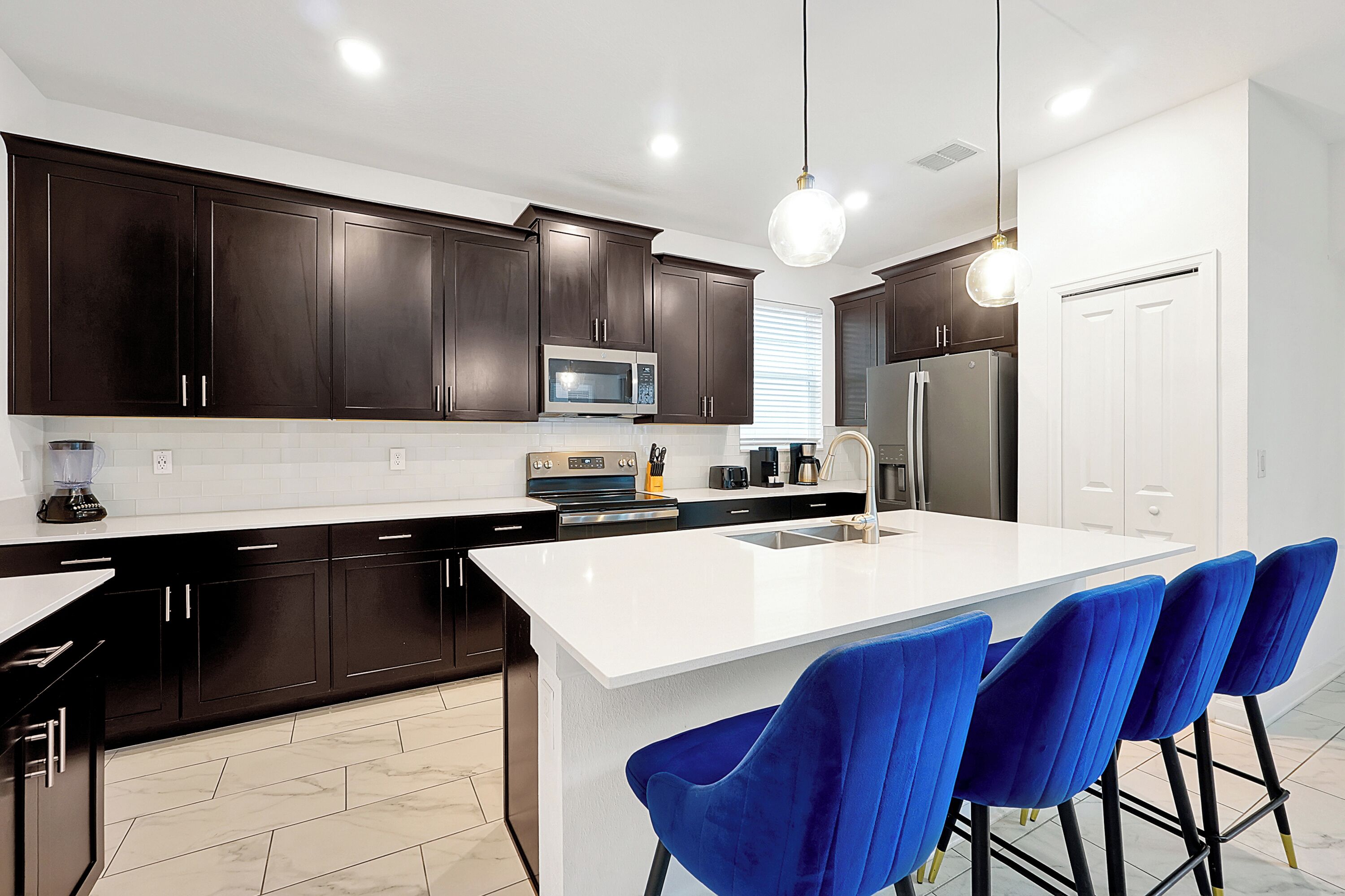 Fully equipped kitchen at Champions Getaway 5BR vacation home Davenport FL